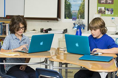 Two students working on computers