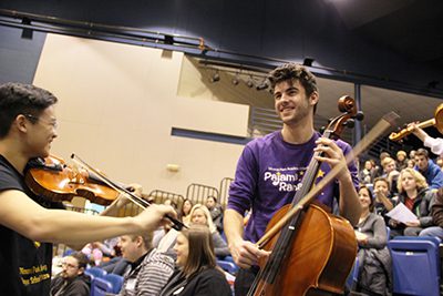 High school students playing orchestra instruments