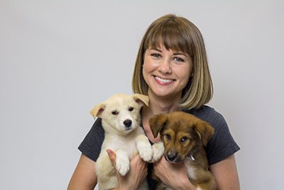 Rose Miller '06 with puppies