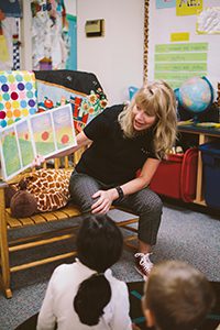 Kindergarten teacher reading a story