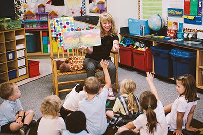 Kindergarten students listening to a story