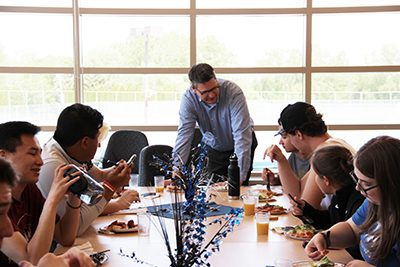 dr Hudson eating lunch with seniors