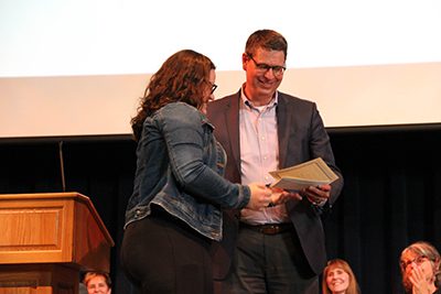 Julia portis receiving award from dr. Hudson 