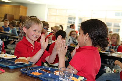 Two lower school kids in the cafeteria