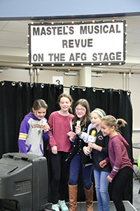 Middle School girls singing karaoke