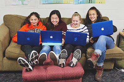 middle school girls working together in class