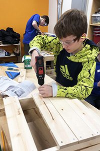 Middle Schooler in woodworking class