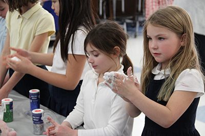 Two Lower Schoolers playing with slime