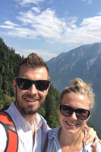 Two people standing on a mountain