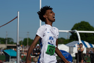 Yahya Madar celebrates after winning the state high jump