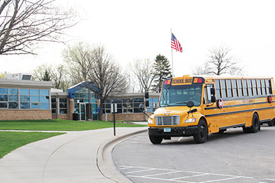 Bus pulling up to Mounds Park Academy