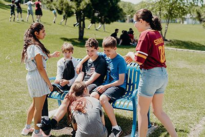 middle school students socializing outside 