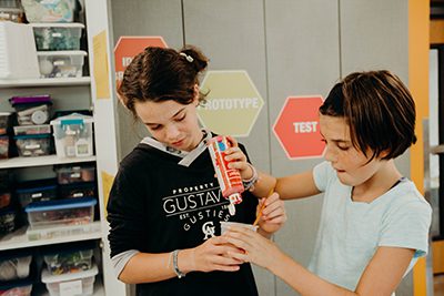 two middle schoolers working together in the makerspace