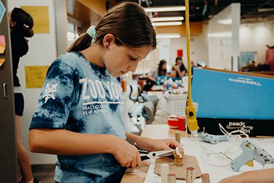 middle school student Zara working on her power of we mobile