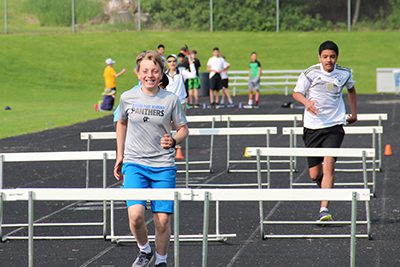 middle school track and field day hurdlers