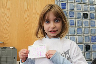 first grader making a thank you card for blood drive donors