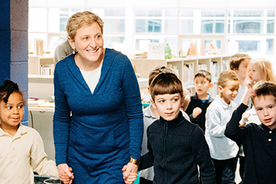 Nancy sage bringing lower schools students through the new library