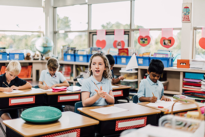 student listening to teacher in class