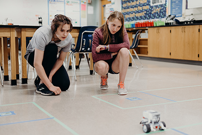 students working on a robot