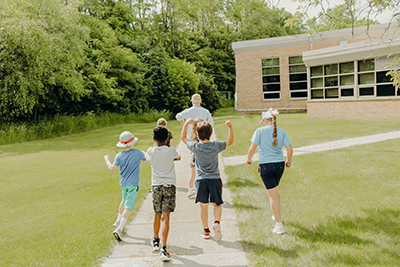 panther camp campers going outside