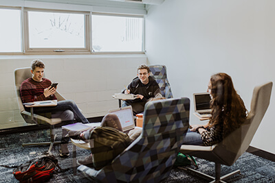 upper school students working together in the study rooms