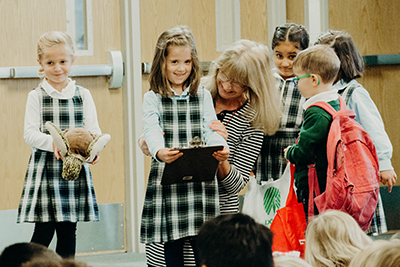 kindergartners sharing their initiative with upper school