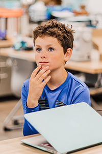 middle school student in class in the makerspace