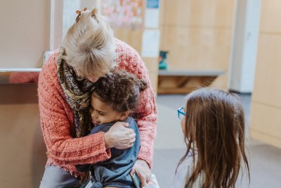 Ms. Petersen hugs a student