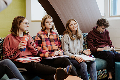 upper school students having social studies class discussion