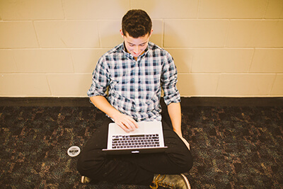 upper school student using his laptop