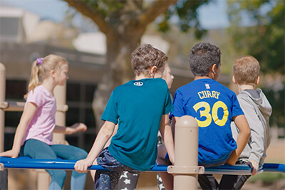 middle school students together on the playground