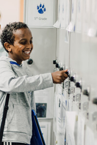 middle school student at his locker