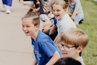 middle school students cheering at the senior walk