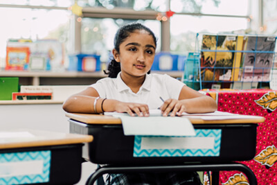 lower school student working at desk