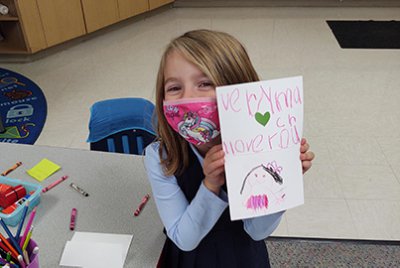 lower school student with their special note