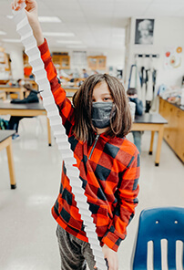 middle school student doing a science lab