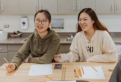 two international students in the makerspace