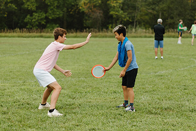 Two Middle School students playing together in PE