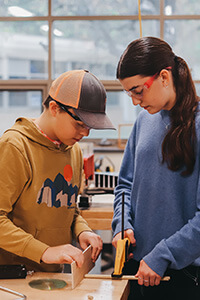 9th graders working together on the mousetrap car project