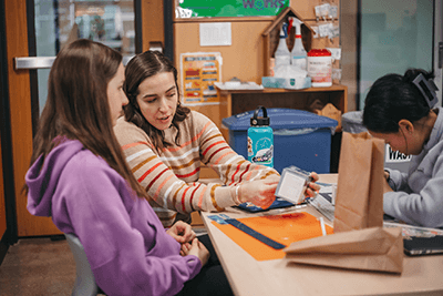 Middle School teacher and student working in the makerspace