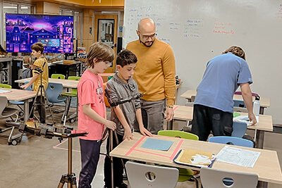 Students and Mr. Moran in the Makerspace