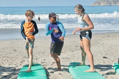 students learning to surf in Costa Rica during iterm
